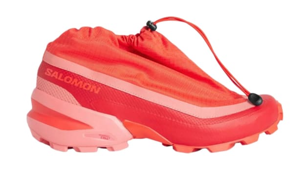 Side view of red shoe with drawstring.